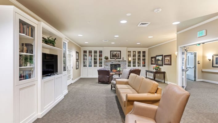 Cozy common area with seating and a fireplace