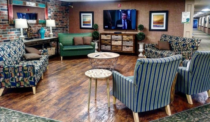 Common area with seating and television