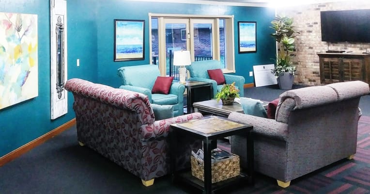 Cozy common area with seating and artwork