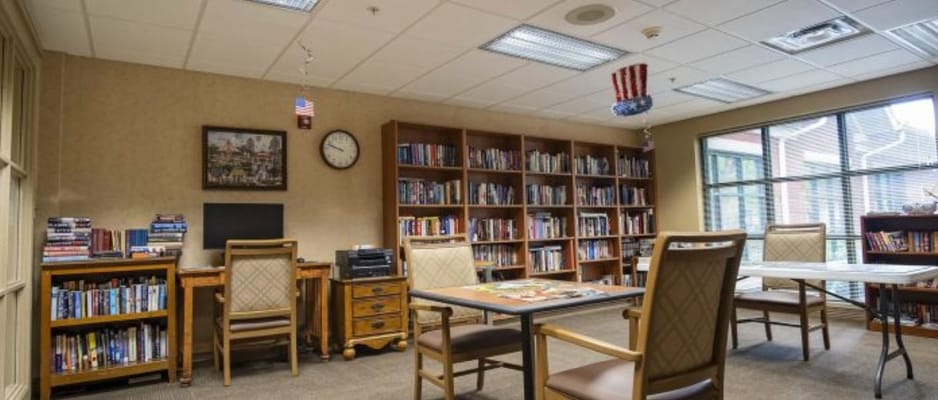 Bright reading room with bookshelves and tables