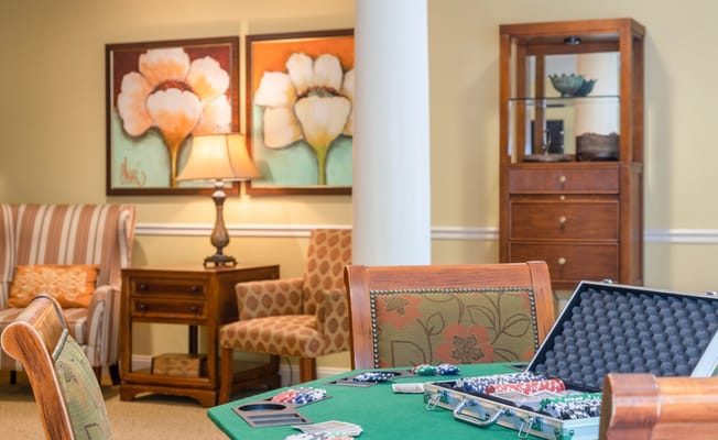 Poker chips and game table in a cozy lounge
