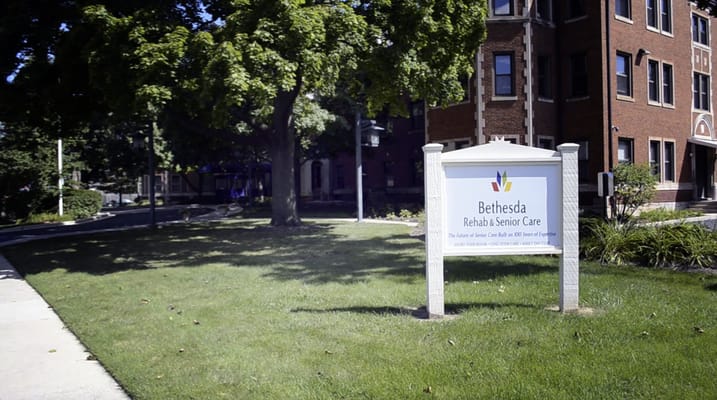 Sign for Bethesda Rehab Senior Care in a landscaped area