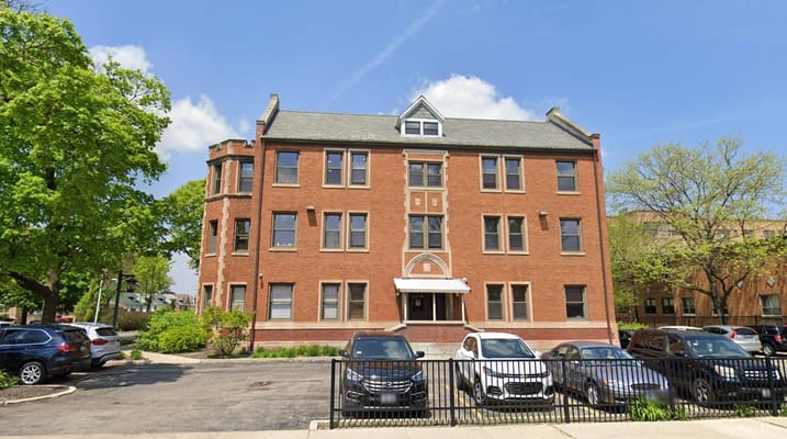 Exterior view of a senior living facility with parking