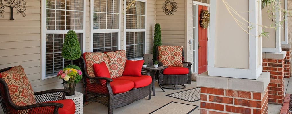 Outdoor seating area with comfortable chairs and decorative plants
