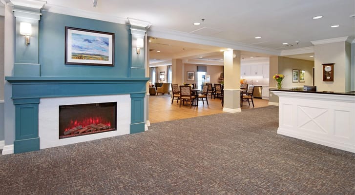 Interior view of a cozy common area with a fireplace
