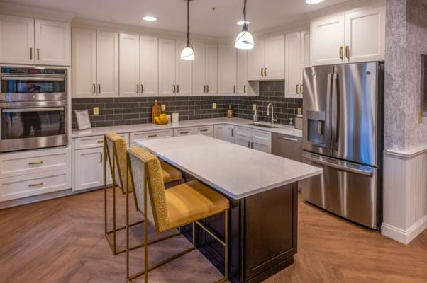 Bright, modern kitchen area with seating