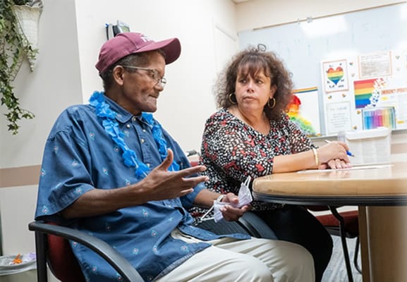 Residents engaging in a conversation during an activity