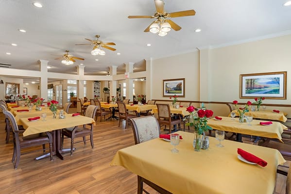 Dining room with tables set for residents
