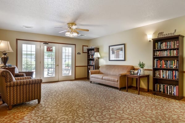 Common area with seating and bookshelves