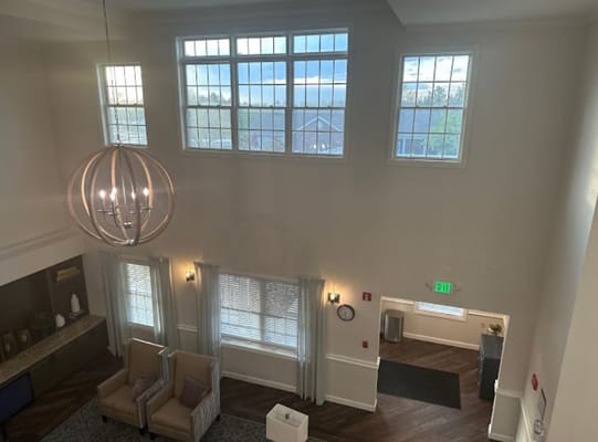 Bright lobby area with modern furniture and large windows