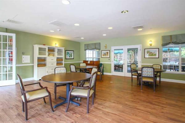 Bright common area with tables and chairs