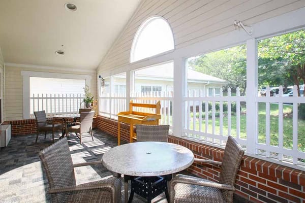 Outdoor seating area with tables and plants