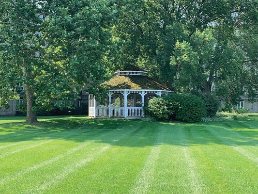 Gazebo in a green outdoor space at the facility