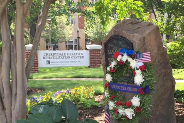 Exterior view of Cherrydale Health facility with memorial