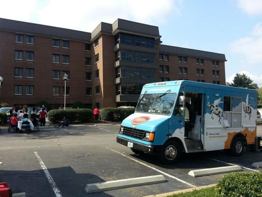 Food truck with residents enjoying an outdoor event