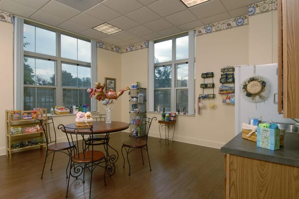 Bright common area with seating and shelves