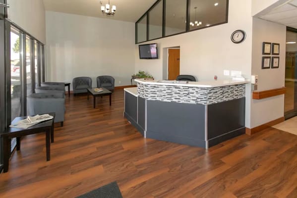 Bright lobby area with seating and reception desk