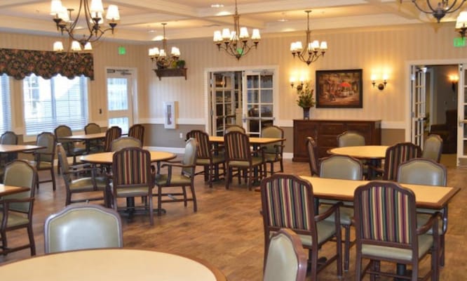 Bright dining room with round tables and chairs