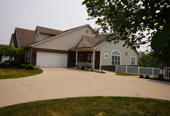 Front view of Coventry Meadows Assisted Living facility showcasing the entrance and driveway.