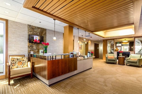 Reception area with floral arrangements and comfortable seating