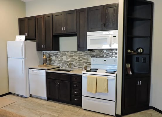 Well-equipped kitchen area in a senior living unit