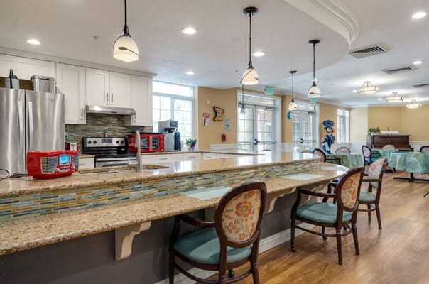 Interior view of a community kitchen with seating