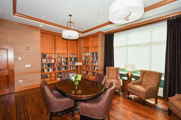 Library with bookshelves and comfortable seating area
