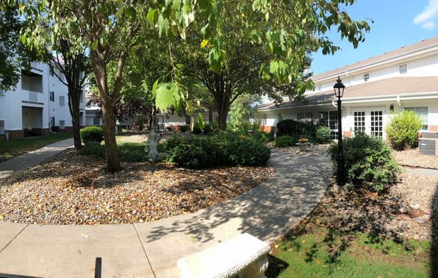 Well-maintained outdoor garden area with pathways