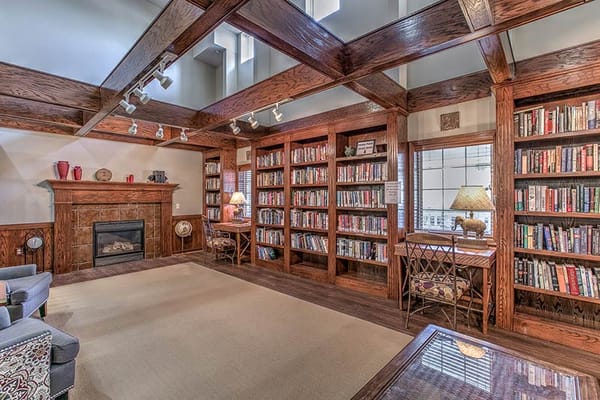 Cozy library with bookshelves and comfortable seating