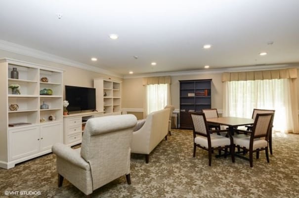 Well-furnished common area with seating and entertainment