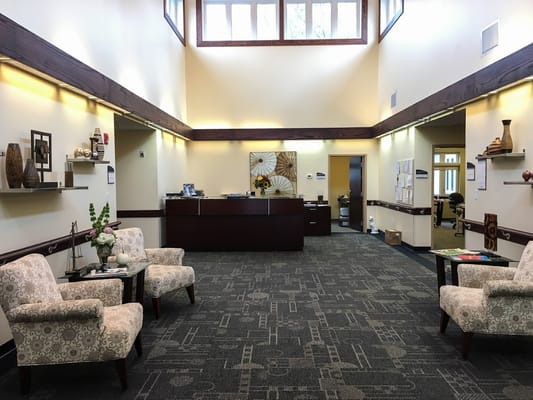 Interior of a lobby with seating and reception desk