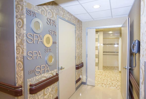 Hallway with spa decor at Hamilton Grove Healthcare and Rehabilitation Center