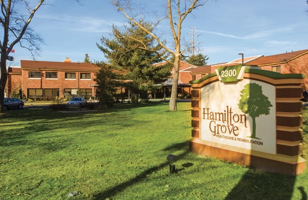 Sign for Hamilton Grove Healthcare and Rehabilitation Center in front of the facility