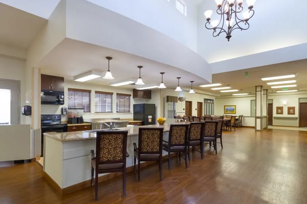 Bright kitchen and dining area with seating at Highline Place