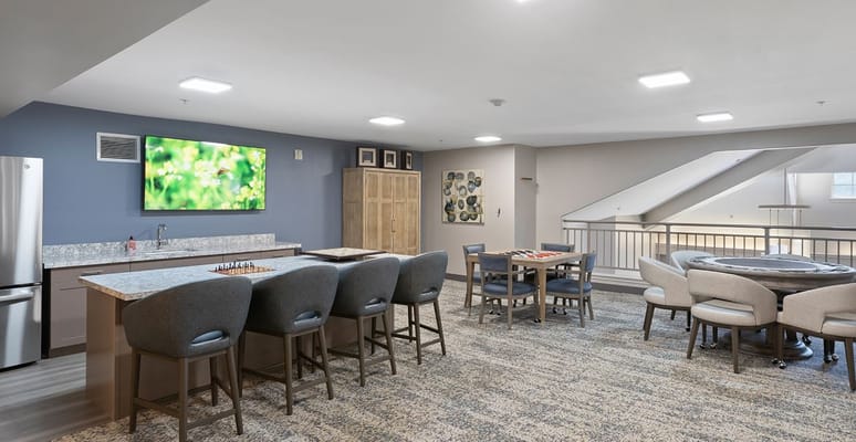 Bright common area with a seating arrangement and games