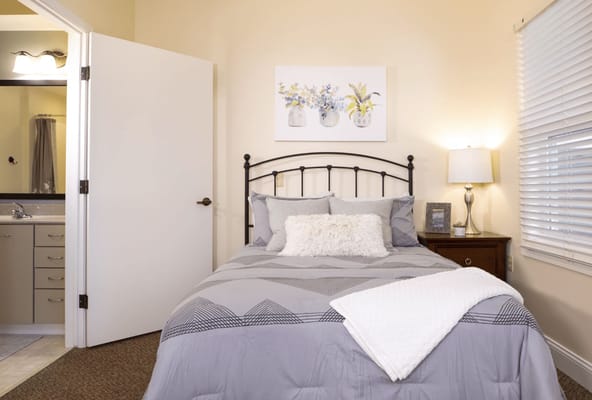 Cozy resident room with a bed and decor