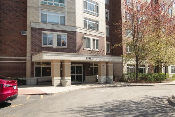 Main entrance of Autumn Green at Wright Campus with parking area