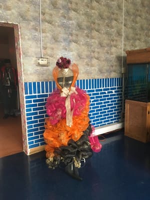 Colorful decorative display with flowers and fabric