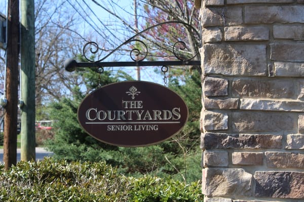 Sign displaying The Courtyards Senior Living