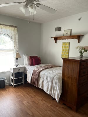 Cozy private resident room with a bed and decor