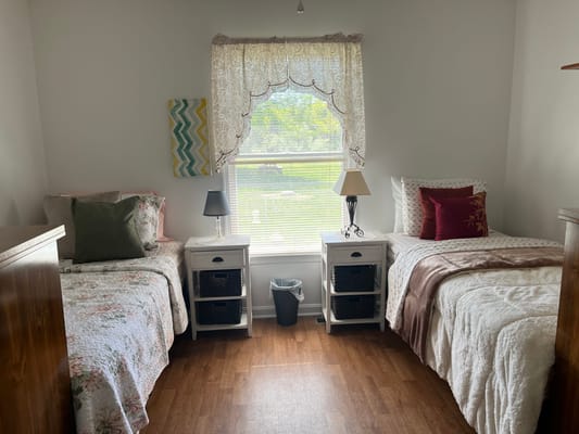 Cozy shared resident bedroom with two beds