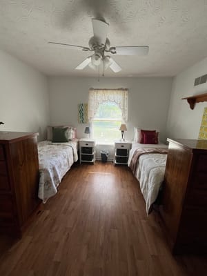 Twin resident bedrooms with natural light