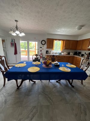 Dining room table set for a meal in a kitchen