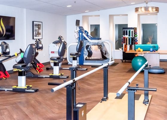 Well-equipped therapy gym with various fitness machines