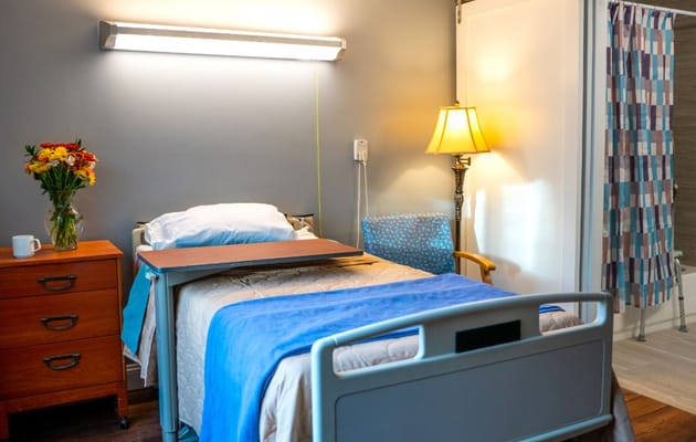 Private resident room with bed and amenities