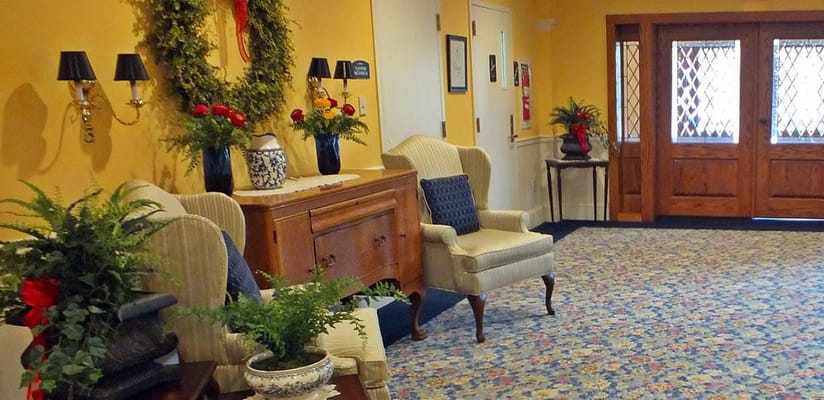 Cozy interior lobby with seating and floral decor