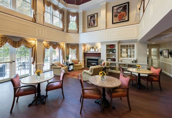 Spacious lounge area with tables and seating in Kensington Park.