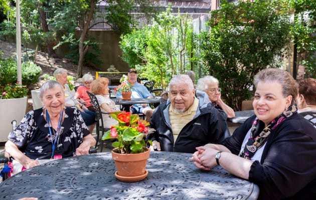 Residents enjoying time in a garden area