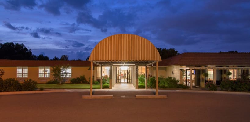Front entrance of Legacy Heights Nursing Home at dusk