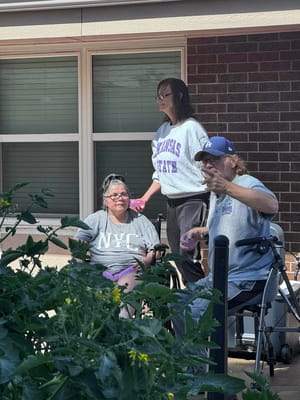 Residents enjoying time outdoors in a garden area
